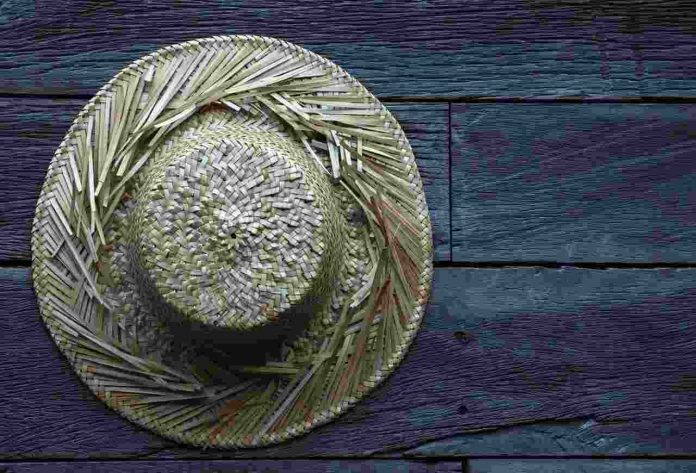 Old Straw hat Wooden Surface Old Straw hat Wooden Surface